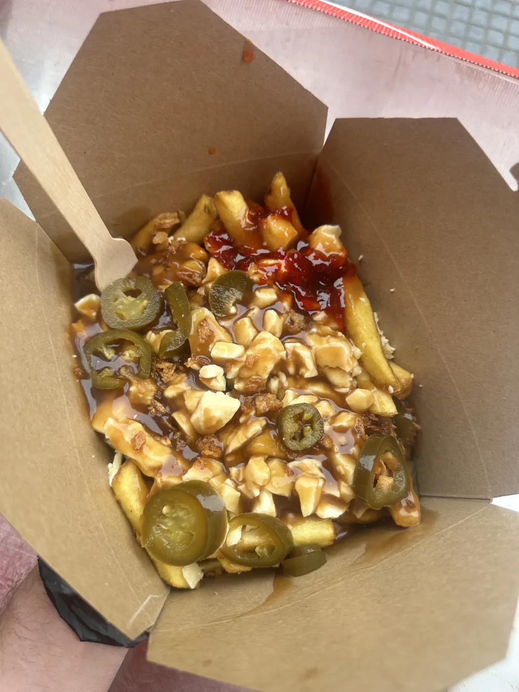 Loaded chips with gravy, cheese and jalapeños