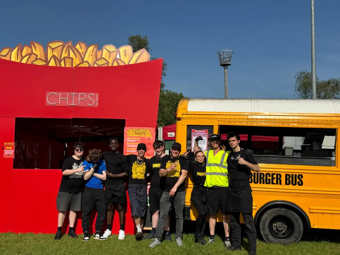 The crew standing between the CHIPS! stall and the Burger Bus