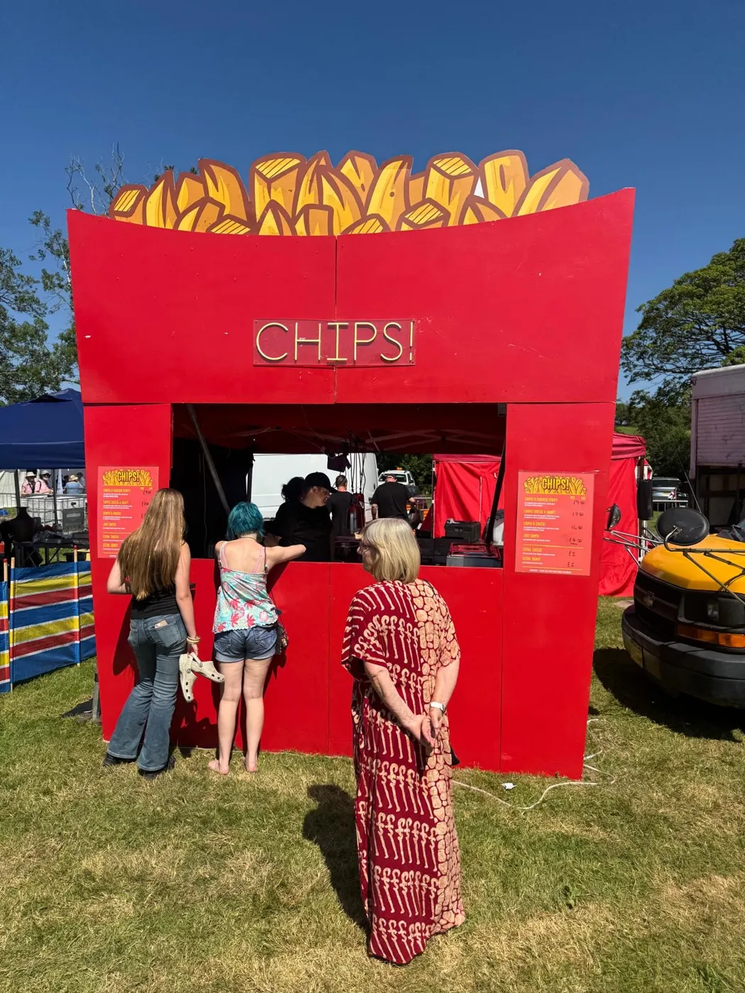 Customers queuing at the CHIPS! stall at a summer event