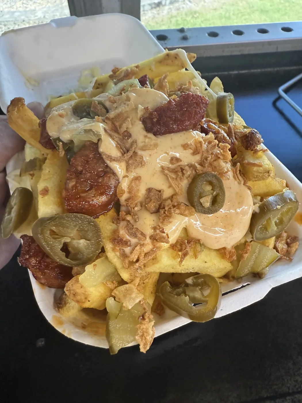 Loaded fries with chorizo, cheese sauce and jalapeños